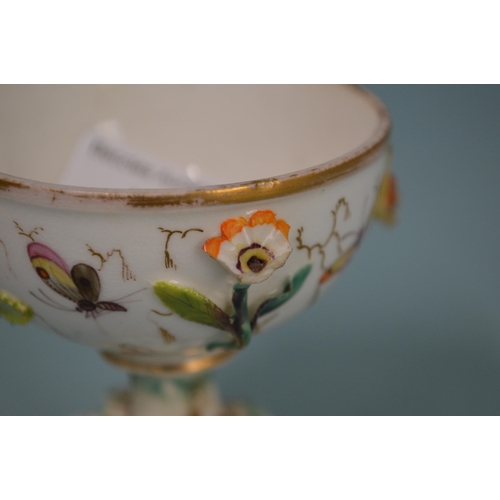 105 - A 19th Century hand painted dish decorated with a bird to the centre, 11