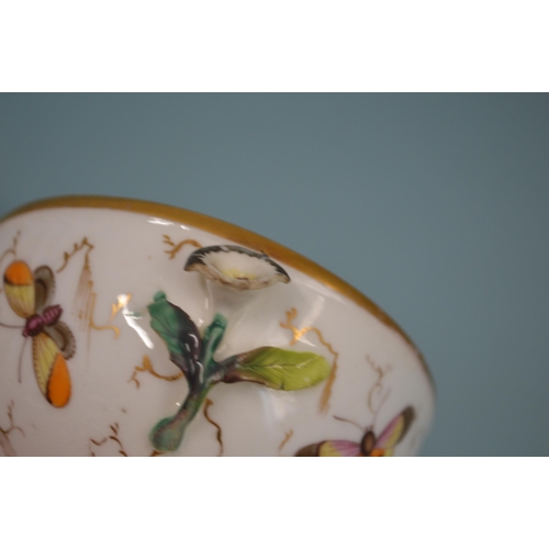 105 - A 19th Century hand painted dish decorated with a bird to the centre, 11