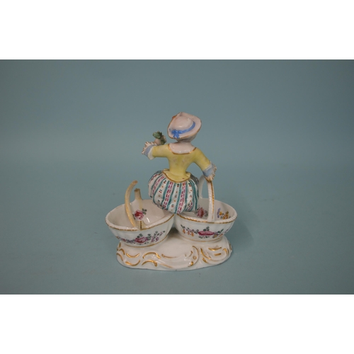 107 - A 19th Century crossed swords mark Meissen style hand painted figure of a girl sitting on two basket... 