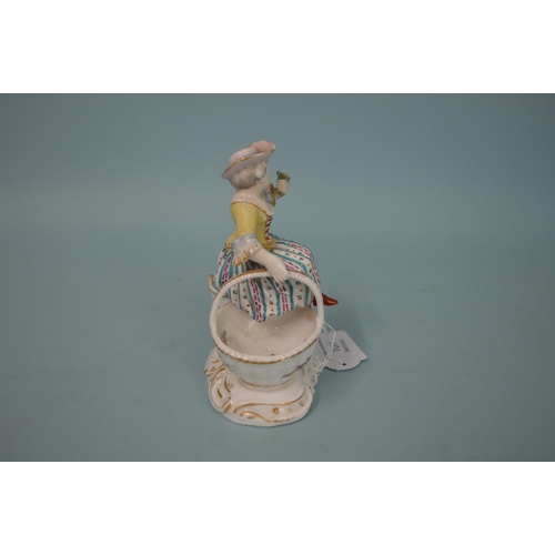 107 - A 19th Century crossed swords mark Meissen style hand painted figure of a girl sitting on two basket... 