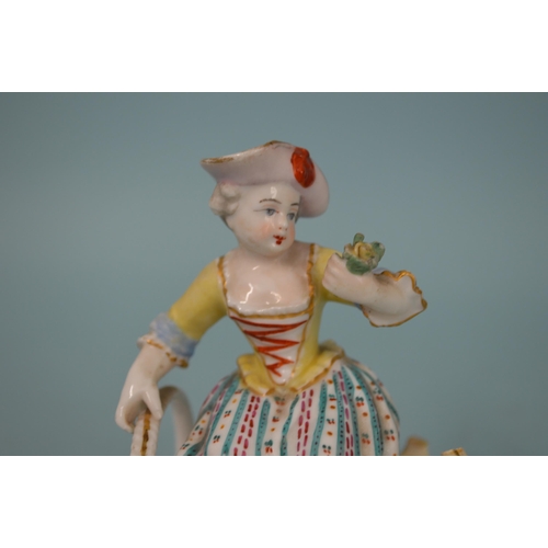 107 - A 19th Century crossed swords mark Meissen style hand painted figure of a girl sitting on two basket... 