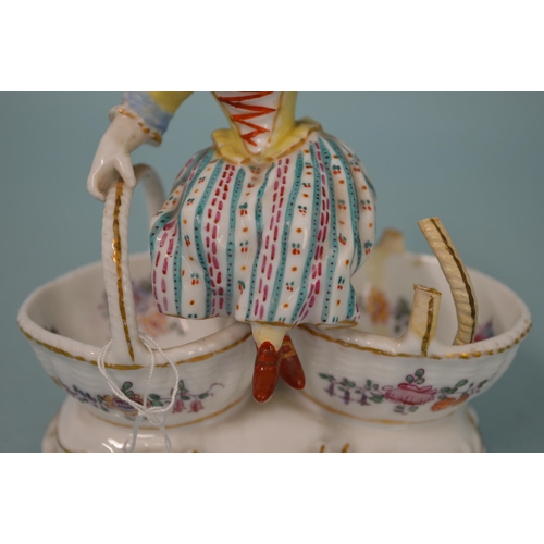 107 - A 19th Century crossed swords mark Meissen style hand painted figure of a girl sitting on two basket... 