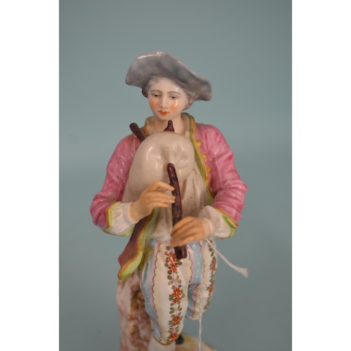 111 - A 19th Century possibly French porcelain figurine of a piper, hand painted, 8