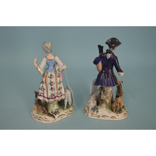 114 - A pair of early 20th Century porcelain figurines with blue cross swords mark in the Meissen manner, ... 