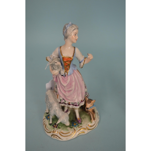 114 - A pair of early 20th Century porcelain figurines with blue cross swords mark in the Meissen manner, ... 