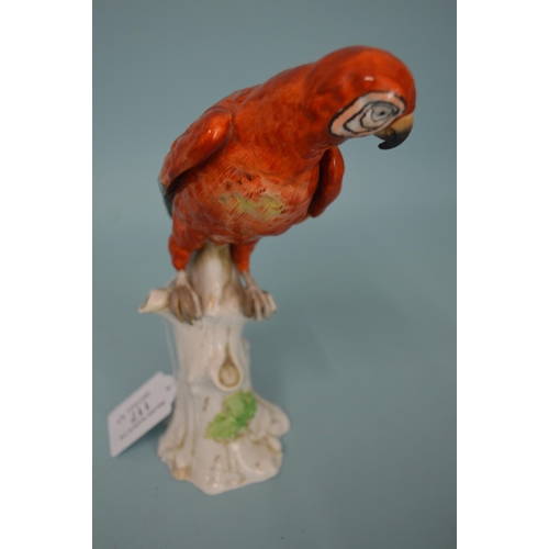 117 - Two early 19th Century continental porcelain bird figurines, the parrot with blue cross hatch mark, ... 