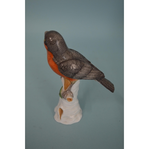 117 - Two early 19th Century continental porcelain bird figurines, the parrot with blue cross hatch mark, ... 