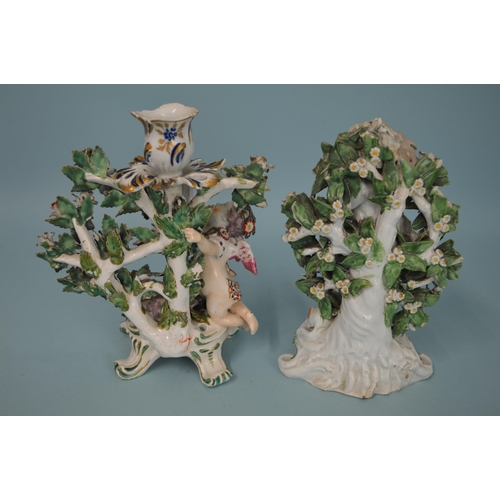 120 - Two early 19th Century continental porcelain figurines, the man with dog surrounded by a bocage, 7 1... 