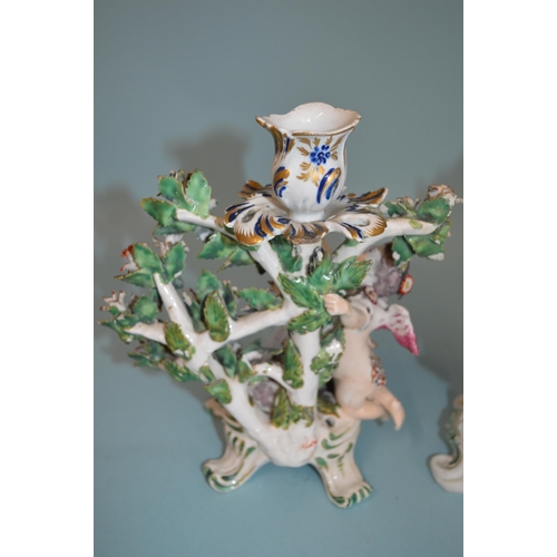 120 - Two early 19th Century continental porcelain figurines, the man with dog surrounded by a bocage, 7 1... 