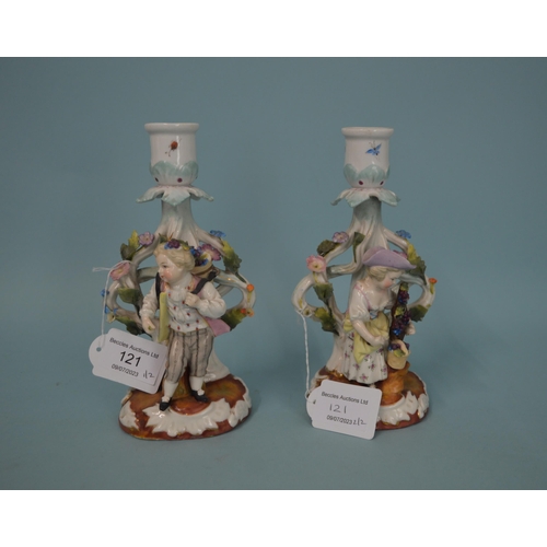 121 - A pair of 19th Century German porcelain candlestick figurines, blue crossed mark to base, hand paint... 