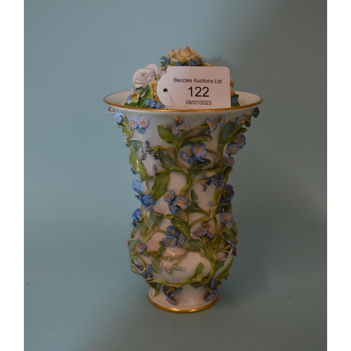 122 - An early 19th Century porcelain flower encrusted lidded vase, Meissen style blue cross sword marks t... 