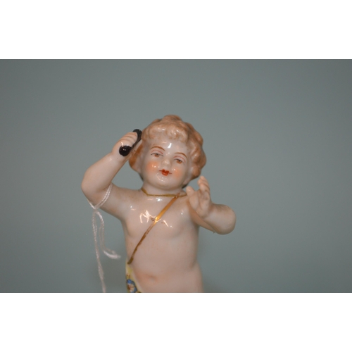 123 - A mid 19th Century continental porcelain putto figure, 4