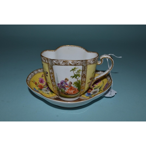 129 - A late 19th Century Anjelica Kauffman Dresden hand tinted porcelain cup and saucer, blue crossed swo... 