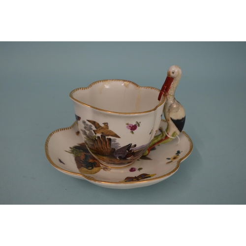 131 - A late 18th Century Meissen porcelain hand painted cup and saucer, blue crossed swords marks to base... 