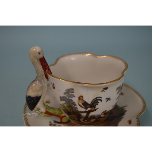 131 - A late 18th Century Meissen porcelain hand painted cup and saucer, blue crossed swords marks to base... 