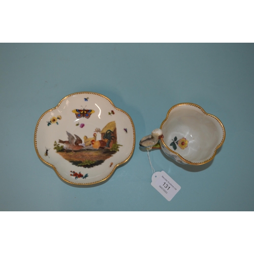 131 - A late 18th Century Meissen porcelain hand painted cup and saucer, blue crossed swords marks to base... 