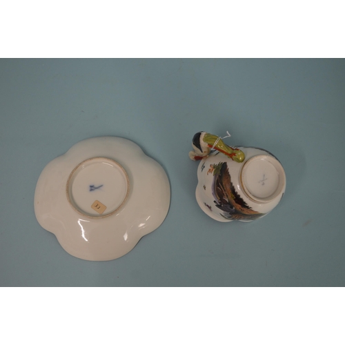 131 - A late 18th Century Meissen porcelain hand painted cup and saucer, blue crossed swords marks to base... 