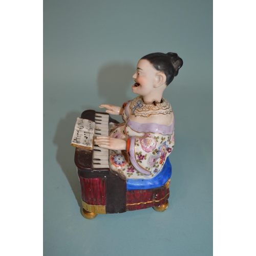 132 - A late 19th Century continental porcelain possibly Dresden nodder figure with moving head, tongue an... 