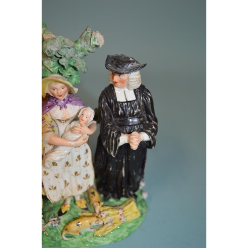 135 - A late 18th Century Derby Dewsbury period humorous porcelain figure group with a parson and a couple... 