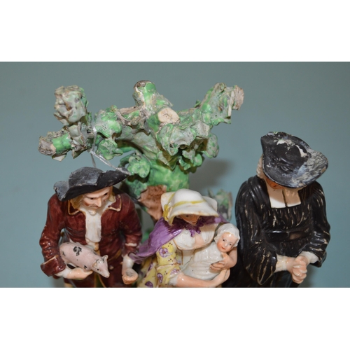 135 - A late 18th Century Derby Dewsbury period humorous porcelain figure group with a parson and a couple... 