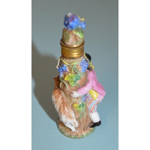 136 - Two late 18th Century/early 19th Century porcelain figural perfume bottles, each modelled as a figur... 