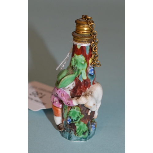 136 - Two late 18th Century/early 19th Century porcelain figural perfume bottles, each modelled as a figur... 