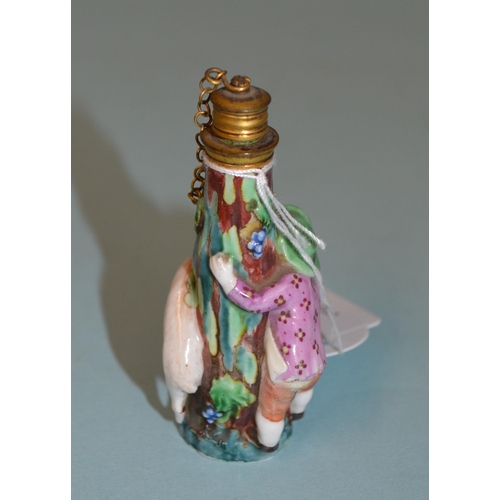 136 - Two late 18th Century/early 19th Century porcelain figural perfume bottles, each modelled as a figur... 