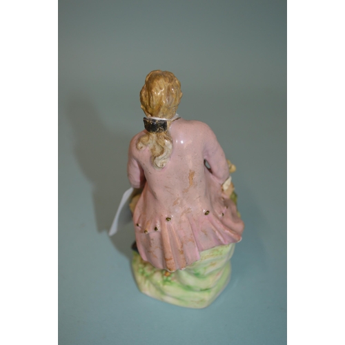 138 - A late 18th Century Derby Dewsbury period male figurine with dog, pad mark to base and impressed num... 