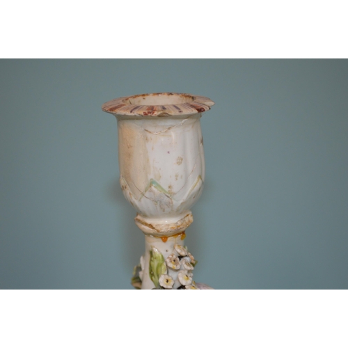 144 - An 18th Century Derby Dewsbury period bird flower encrusted candlestick, pad/patch marks to base, 9 ... 