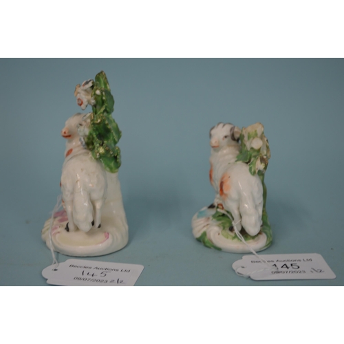 145 - Two 18th Century porcelain Derby Dewsbury period sheep, patch marks to base, the tallest 3 1/2