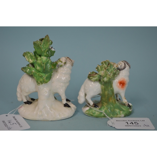 145 - Two 18th Century porcelain Derby Dewsbury period sheep, patch marks to base, the tallest 3 1/2