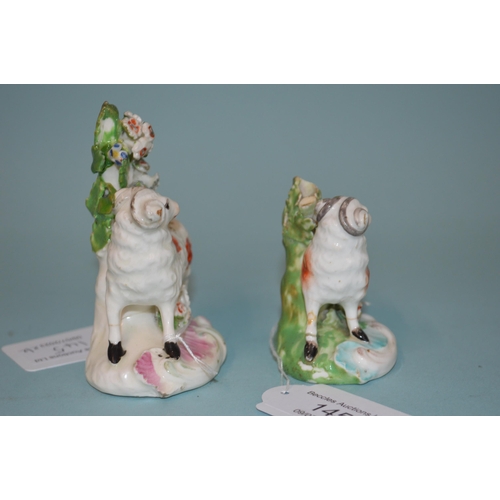 145 - Two 18th Century porcelain Derby Dewsbury period sheep, patch marks to base, the tallest 3 1/2