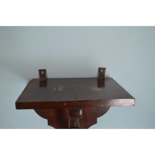 177 - A Victorian mahogany wall bracket with hairy paw base, 12