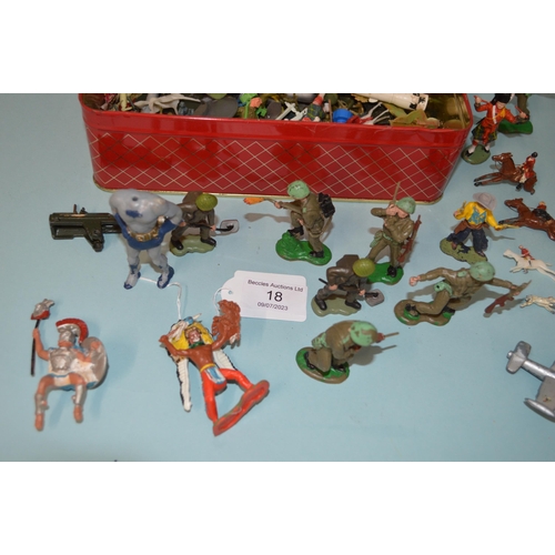 18 - A biscuit tin of various vintage lead and plastic figures plus four lead horses and riders (as found... 