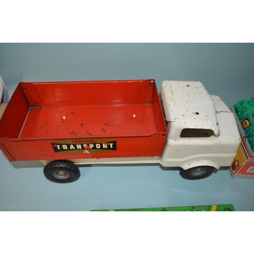 19 - Two Russian made tin plate clockwork car toys plus a Tri-ang tin plate transport truck, 14 1/4