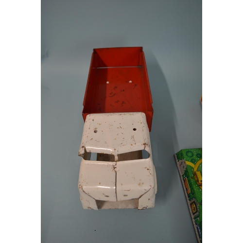 19 - Two Russian made tin plate clockwork car toys plus a Tri-ang tin plate transport truck, 14 1/4