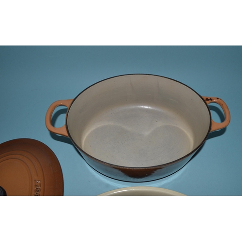 190 - A vintage Le Creuset cast iron lidded casserole dish plus a Le Creuset flat dish (used)