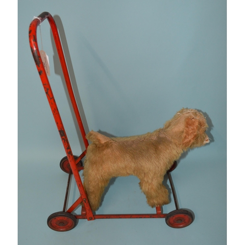 20 - A vintage plush dog push along walker with straw stuffing (as found)