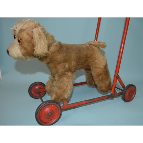 20 - A vintage plush dog push along walker with straw stuffing (as found)