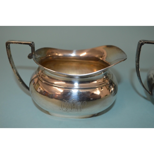 26 - A large sized hallmarked silver sugar and milk, Sheffield 1921, maker CB&S (dent to milk jug), weigh... 