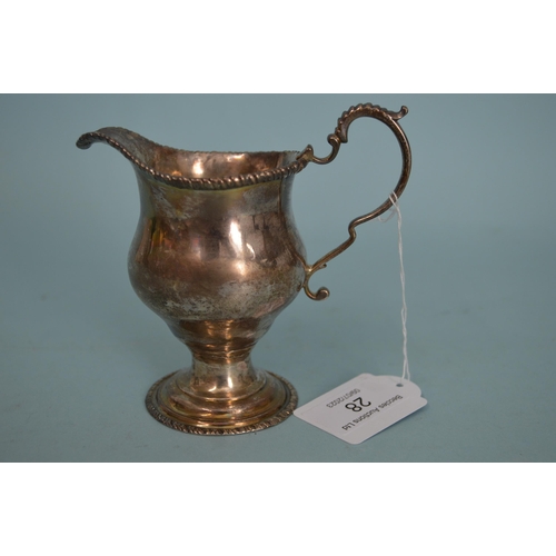 28 - A Georgian hallmarked silver cream ewer, marks rubbed but crowned leopards head visible, 4 1/4