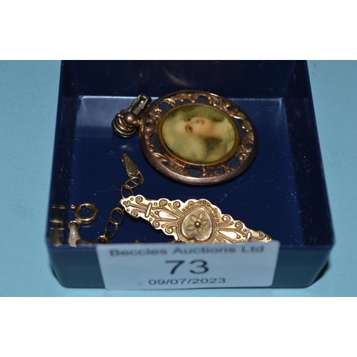 73 - A 9ct gold marked brooch (as found), a ruby set brooch, a 9ct gold locket plus a small three colour ... 