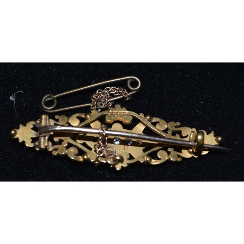 78 - A 15ct gold diamond set brooch with safety chain, weight approx. 5g