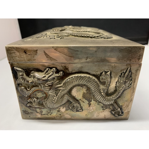 163 - A fine Oriental white metal and wood lined cigar box, elaborately decorated with dragons on all side... 