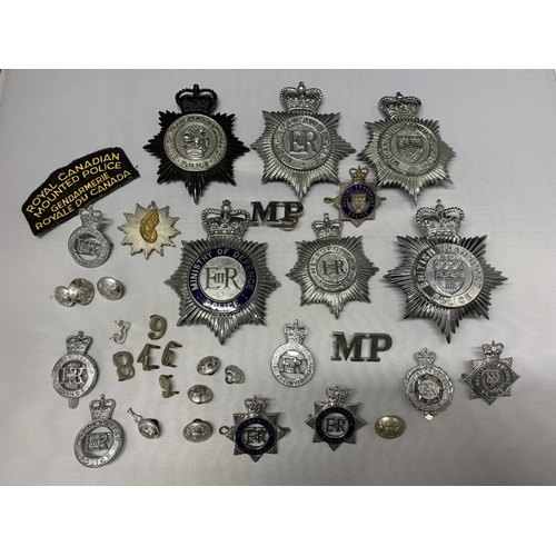 62 - A mixed lot of Police helmet plates plus badges