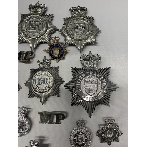 62 - A mixed lot of Police helmet plates plus badges