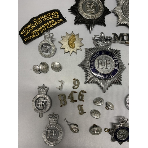 62 - A mixed lot of Police helmet plates plus badges