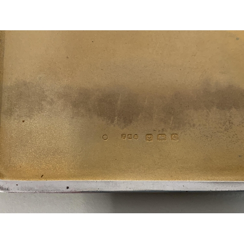 125 - A hallmarked silver cigarette case, Birmingham 1940, maker E J Trevitt & Son, weight approx. 110g