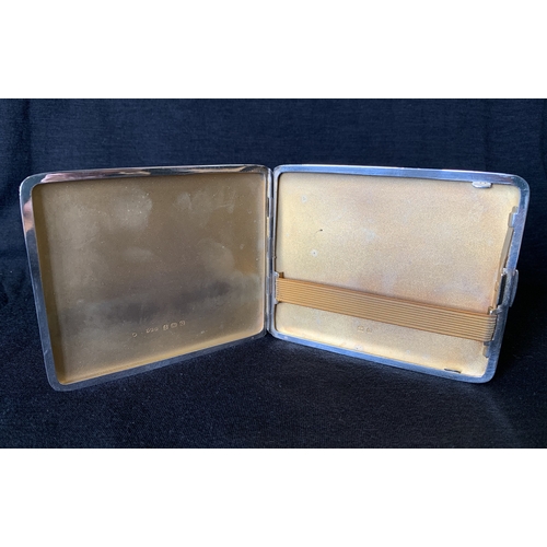 125 - A hallmarked silver cigarette case, Birmingham 1940, maker E J Trevitt & Son, weight approx. 110g