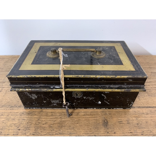 185 - A vintage cash tin with key including a small amount of foreign and British coins